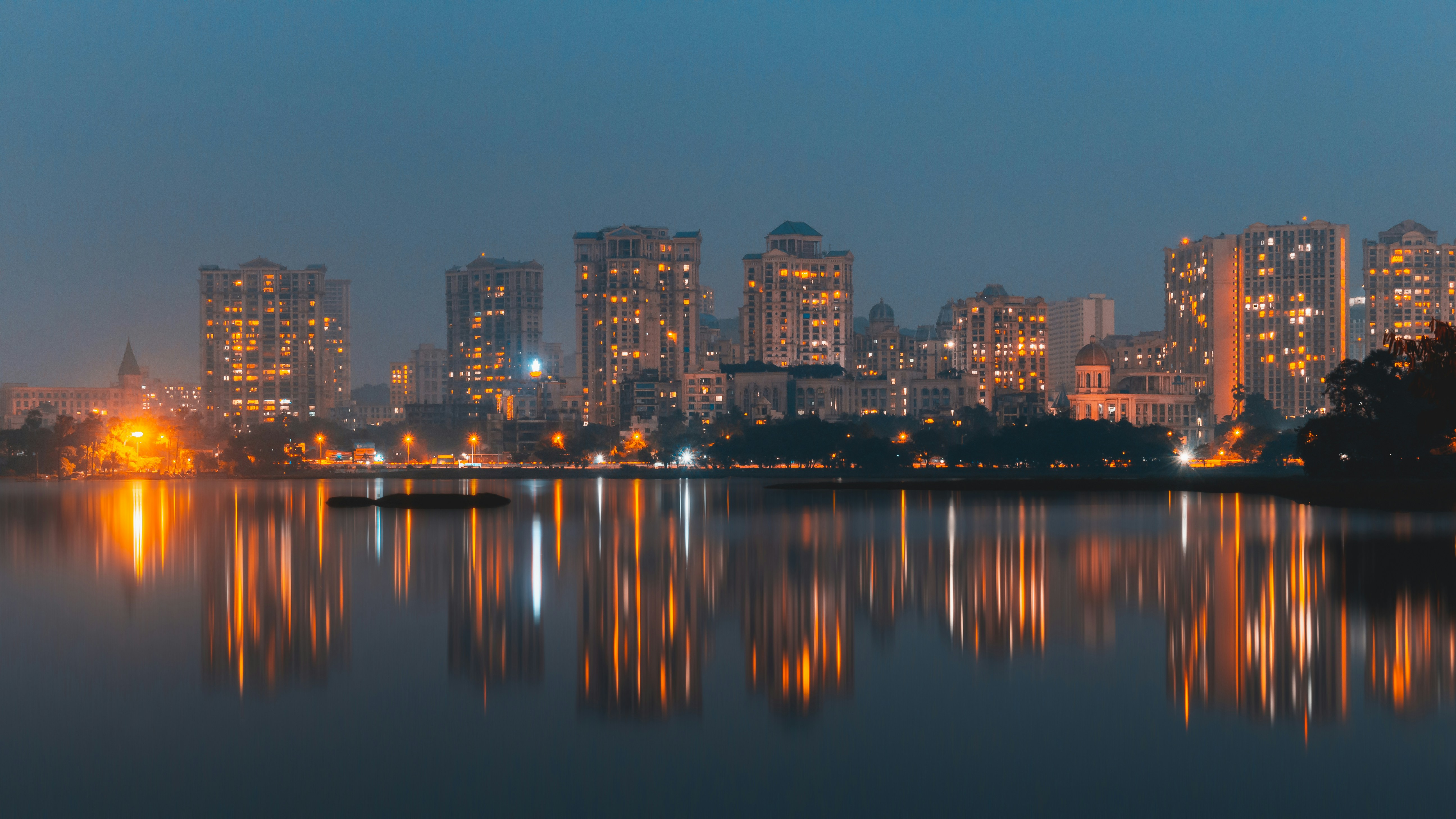 Mumbai skyline at night reflected in the harbour